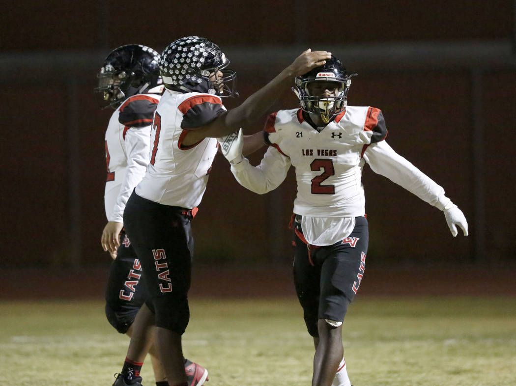 Las Vegas' Miles Davis (2) celebrate his touchdown with his teammate Anthony Coleman, left, dur ...