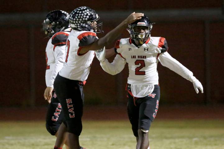 Las Vegas' Miles Davis (2) celebrate his touchdown with his teammate Anthony Coleman, left, dur ...