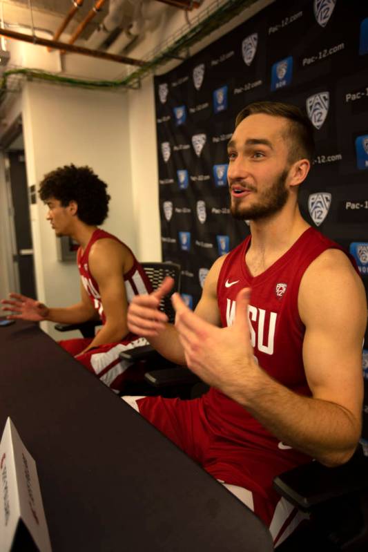 Washington State's CJ Elleby, left, and Jeff Pollard speak during the Pac-12 NCAA college baske ...