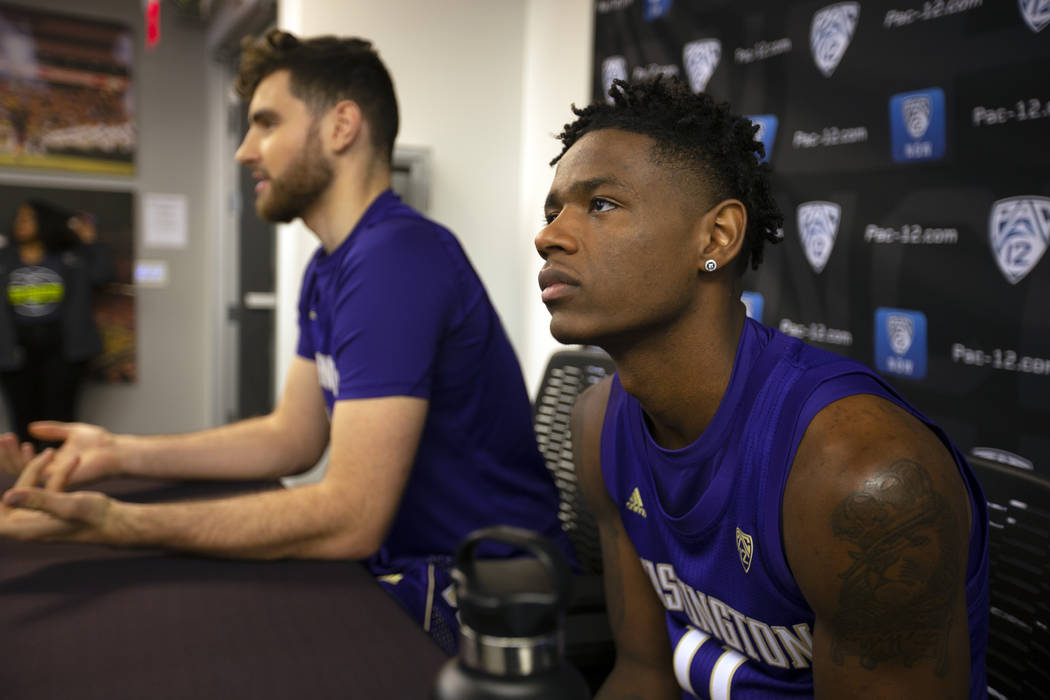 Washington's Sam Timmins, left, and Nahziah Carter speak during the Pac-12 NCAA college basketb ...