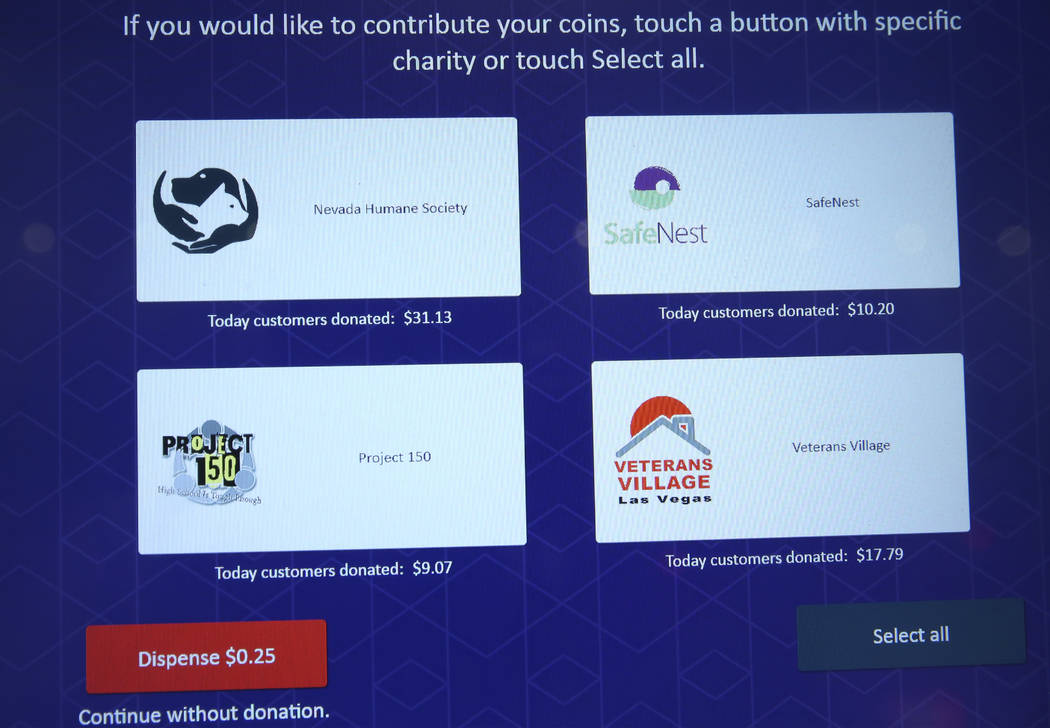 The screen of a redemption kiosk shows charities to donate coins to at the Cosmopolitan hotel-c ...