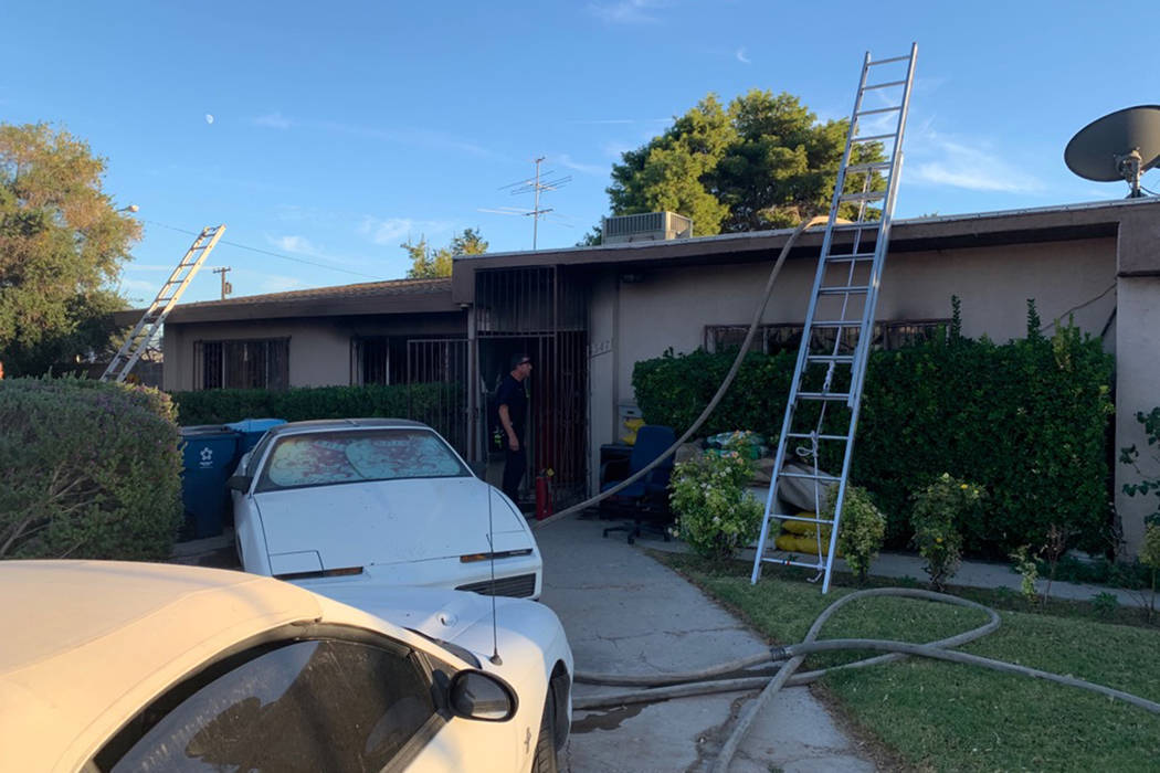 Crews battle a fire Tuesday, Oct. 8, 2019, on the 4500 block of Palmdale Court in Las Vegas. (C ...