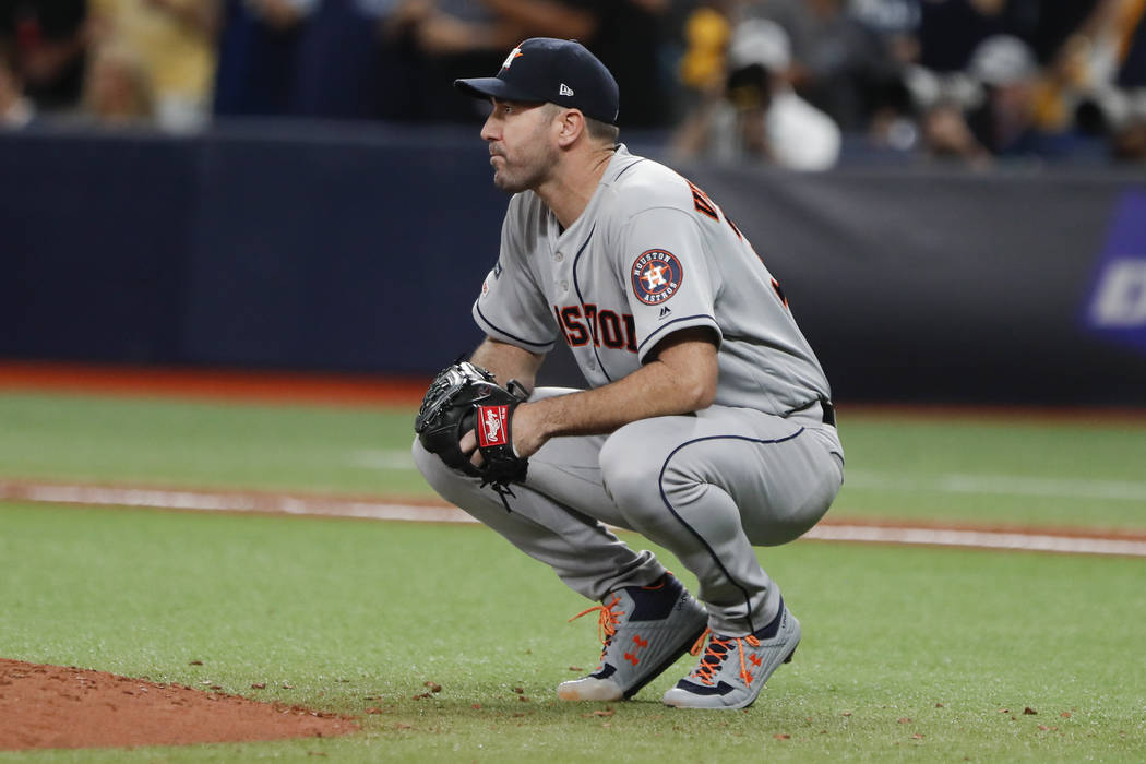 Houston Astros starting pitcher Justin Verlander reacts after giving up a home run to Tampa Bay ...