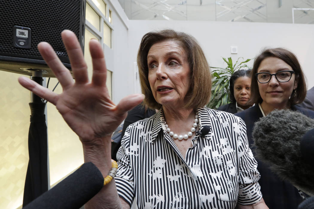 Speaker of the House Nancy Pelosi, D-Calif., left, speaks with media members with Rep. Suzan De ...