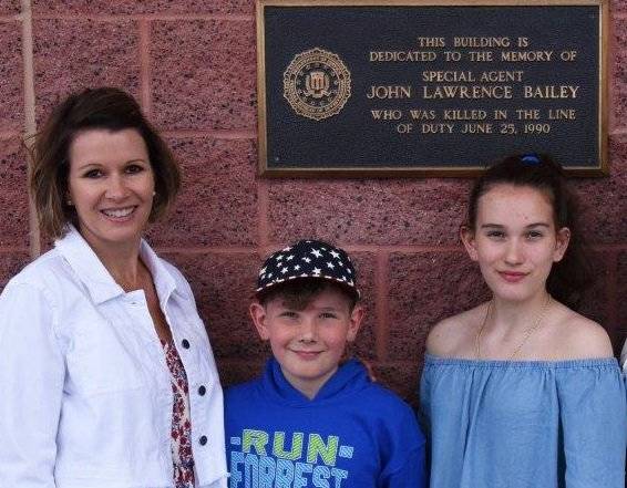 Special Agent John Bailey's daughter and grandchildren outside the FBI building in Las Vegas, w ...