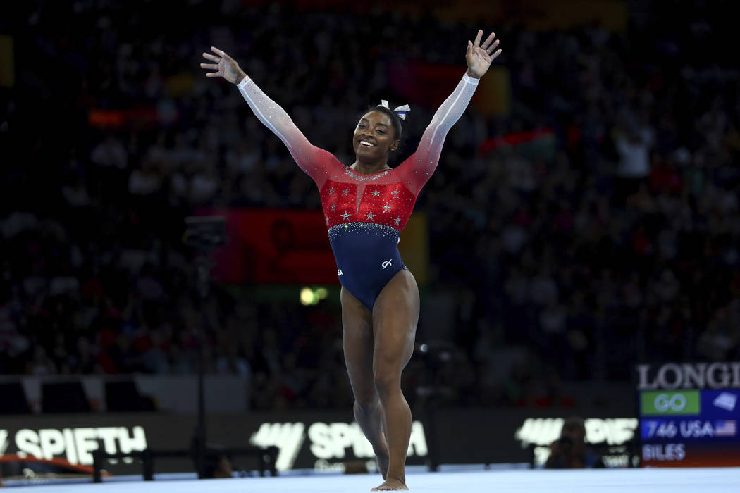 Simone Biles of the U.S. celebrates on the floor during women's team final at the Gymnastics Wo ...
