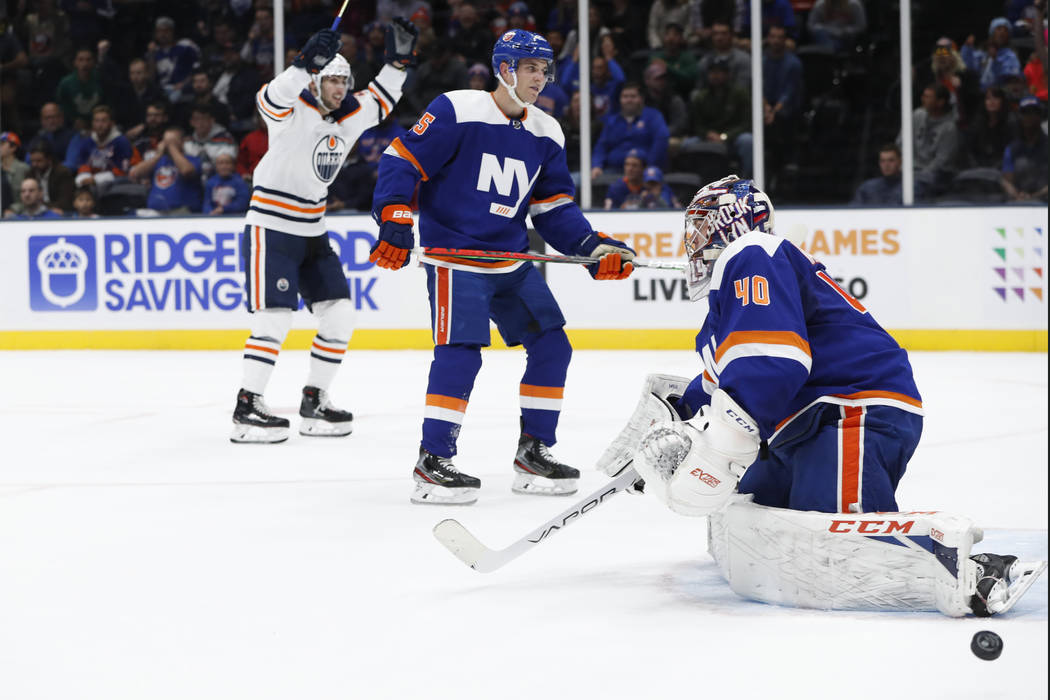 Edmonton Oilers left wing James Neal, left, celebrates after scoring a goal on New York Islande ...