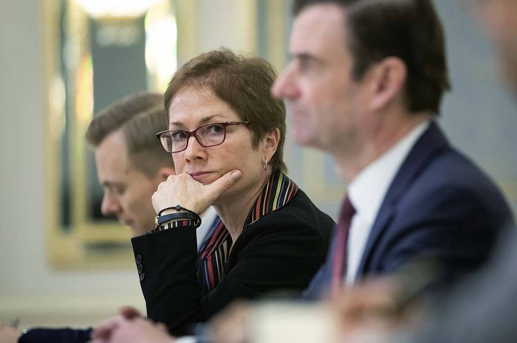 In a March 6, 2019, file photo, then U.S. Ambassador to Ukraine Marie Yovanovitch, center, sits ...