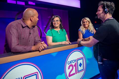 Contestants wait for production to begin on an episode of the game show "Catch 21," filmed at C ...