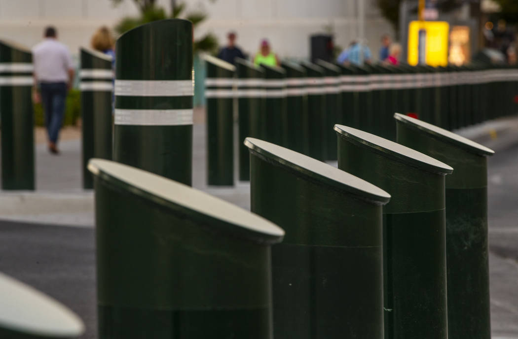 Various sizes of bollards are seen near an exit onto Las Vegas Boulevard South at the Excalibur ...