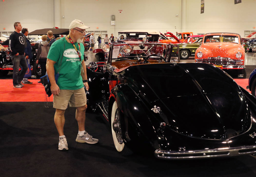 Auctiongoers check out classic cars at the Las Vegas Convention Center during the Mecum Car Auc ...