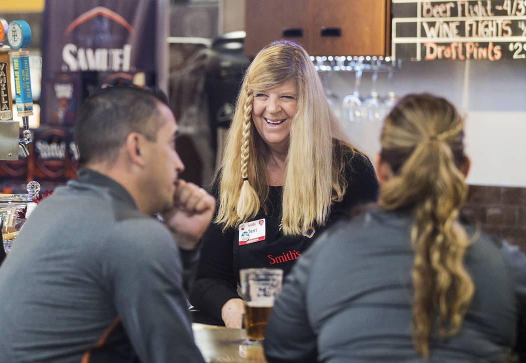 Bartender Terri Wirthlin, middle, talks with patrons at Social Hour Beer and Wine Bar on Thursd ...