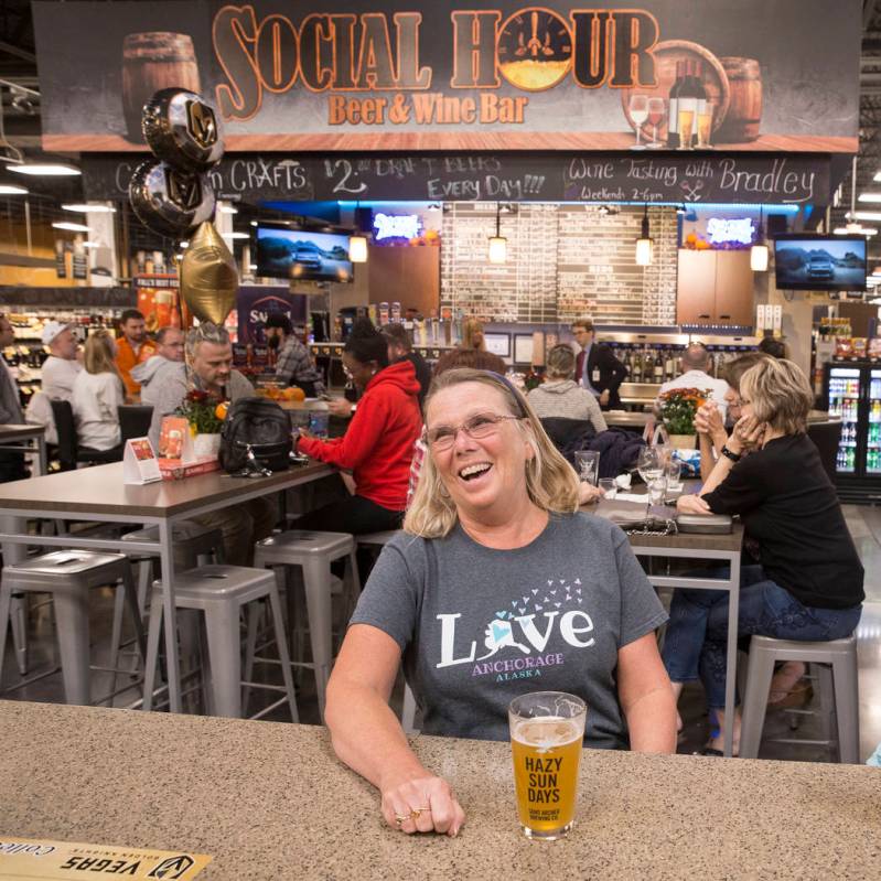 Deb Crowl, from Anchorage, AK., shares a laugh with husband Ron (out of frame) at Social Hour B ...