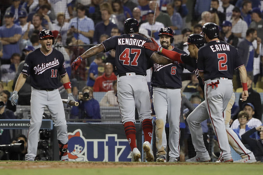 Washington Nationals' Howie Kendrick (47) celebrates after a grand slam against the Los Angeles ...