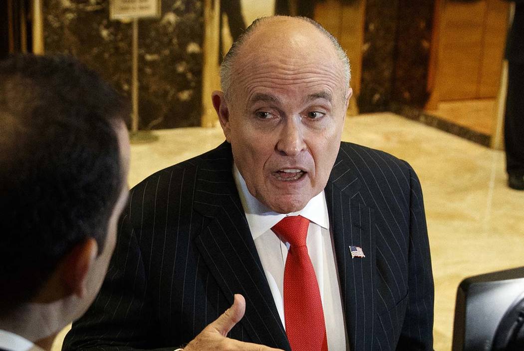 A Jan. 12, 2017, file photo shows former New York City Mayor Rudy Giuliani talking with reporte ...