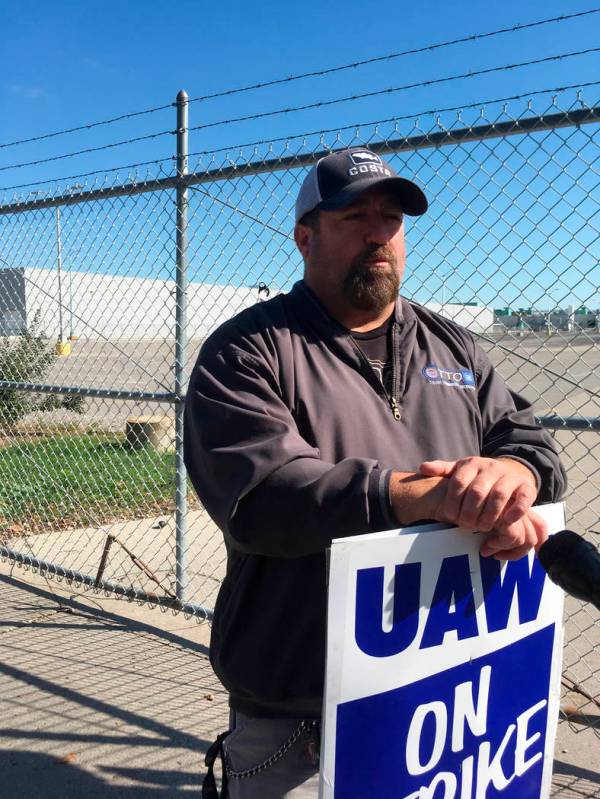 In this Tuesday, Oct. 8, 2019, photo, striking General Motors worker Mike Armentrout stands on ...