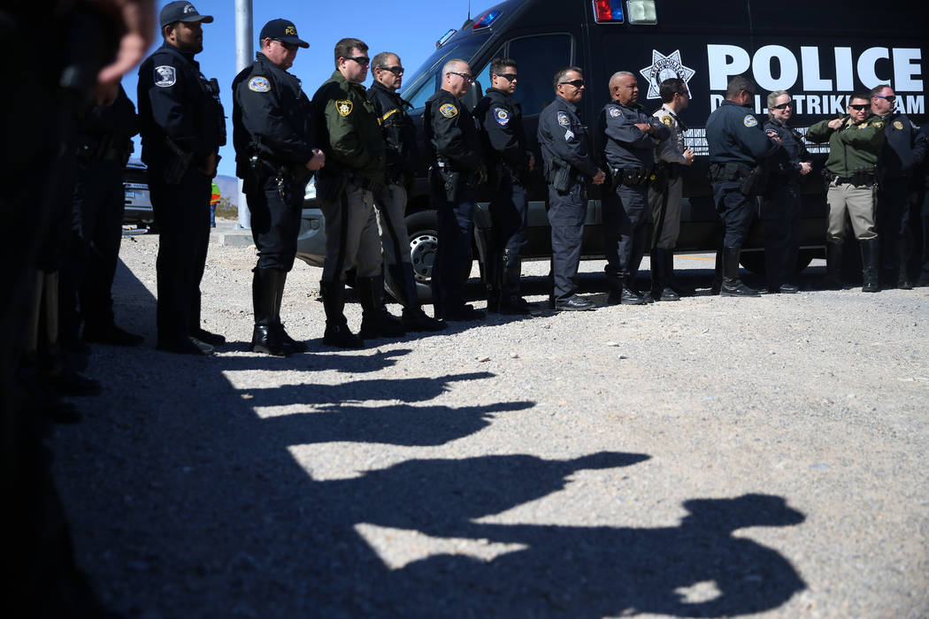 Multi-agency law enforcement officers participate during the DUI Victim Memorial Sign during a ...