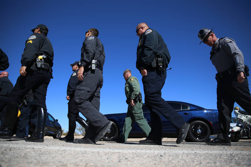 Multi-agency law enforcement officers participate during the DUI Victim Memorial Sign during a ...