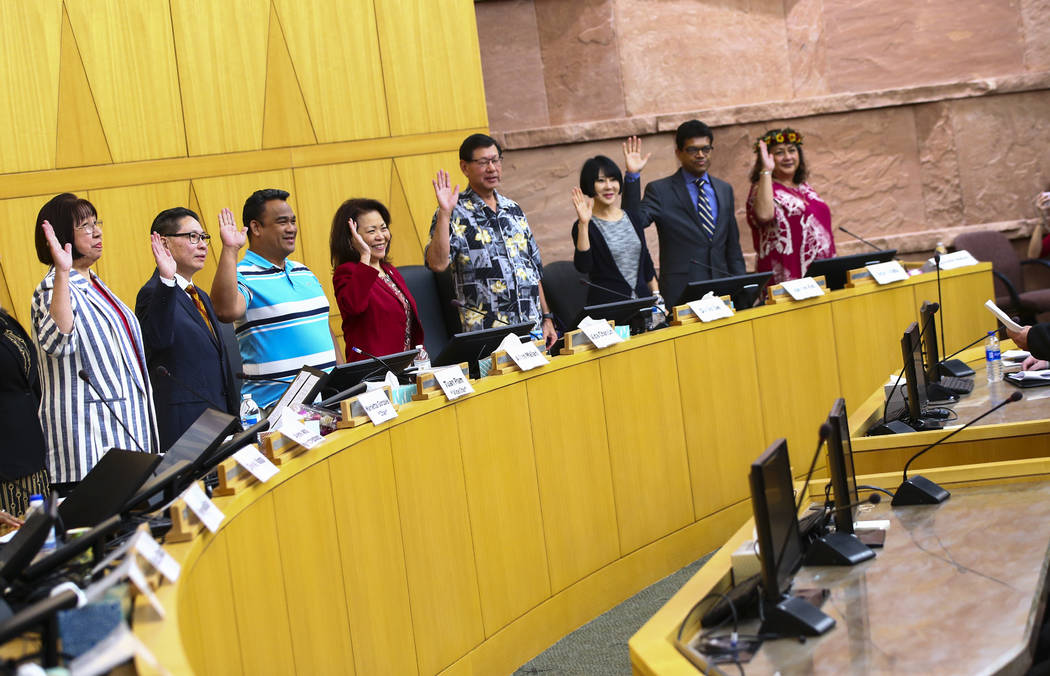 Members of the Asian-American Pacific Islanders Community Commission are sworn in at the Clark ...