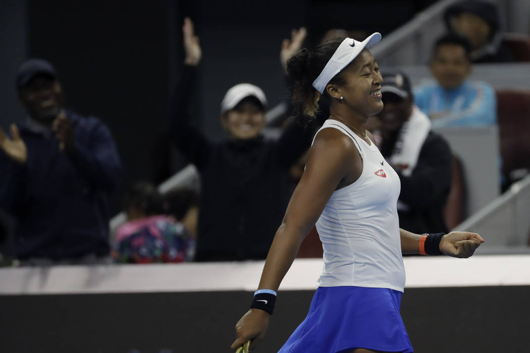 Naomi Osaka of Japan celebrates after defeating Ashleigh Barty of Australia in the women's fina ...
