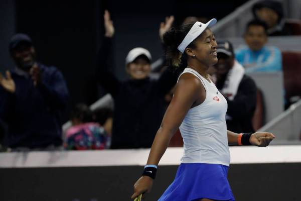 Naomi Osaka of Japan celebrates after defeating Ashleigh Barty of Australia in the women's fina ...