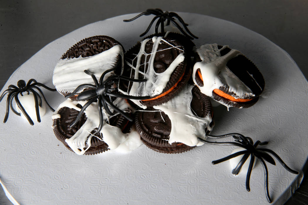 Cookies wrapped in a sweet marshmallow spider web.