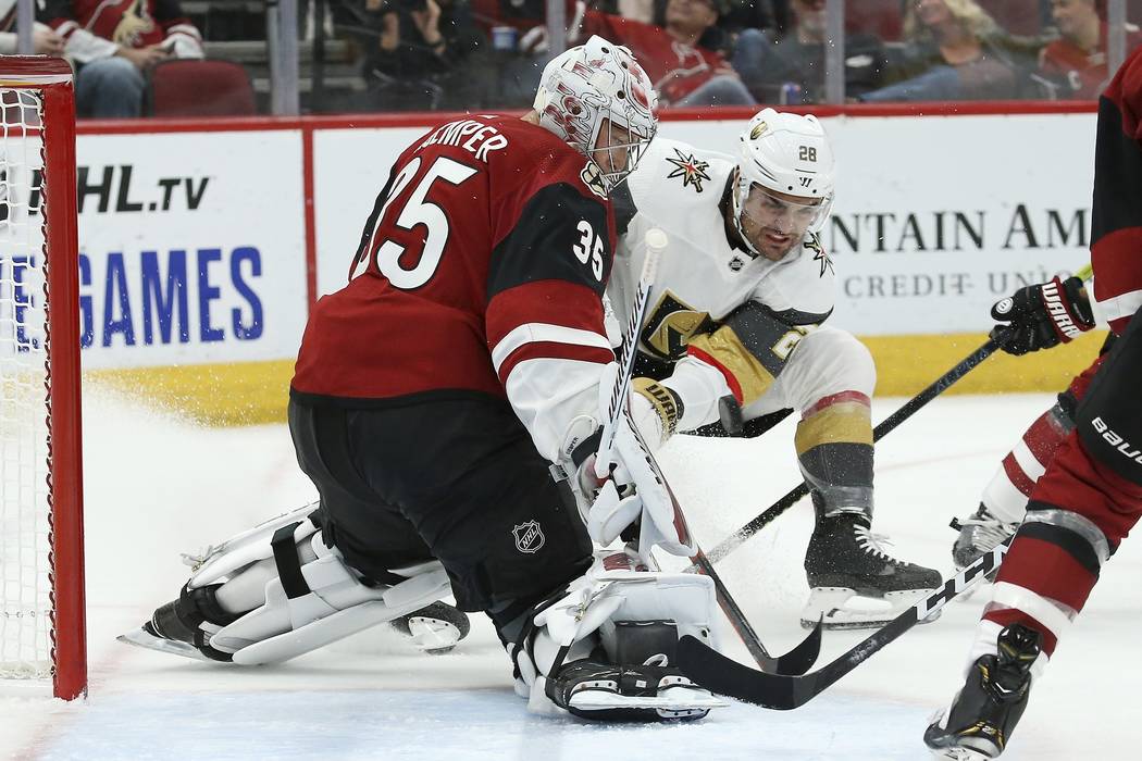 Arizona Coyotes goaltender Darcy Kuemper (35) makes a save on a shot by Vegas Golden Knights le ...