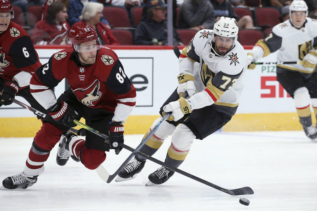 Arizona Coyotes defenseman Jordan Oesterle (82) and Vegas Golden Knights center Brandon Pirri ( ...