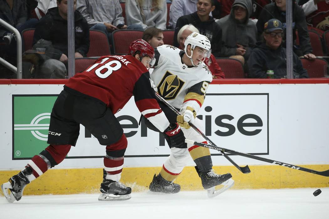 Arizona Coyotes left wing Christian Dvorak (18) works against Vegas Golden Knights left wing To ...