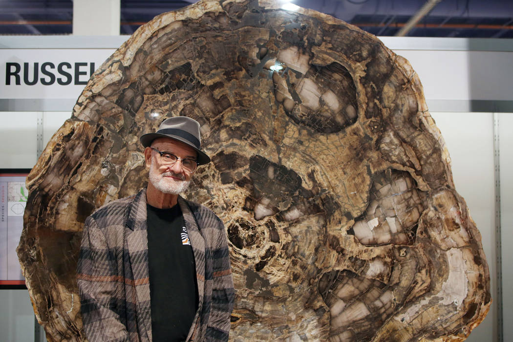 Ralph Thompson of Massachusetts, owner of Russell-Zuhl Petrified Wood, stands in front of a pet ...