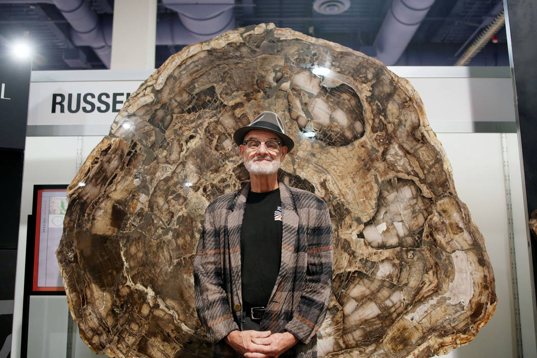 Ralph Thompson of Massachusetts, owner of Russell-Zuhl Petrified Wood, stands in front of a pet ...