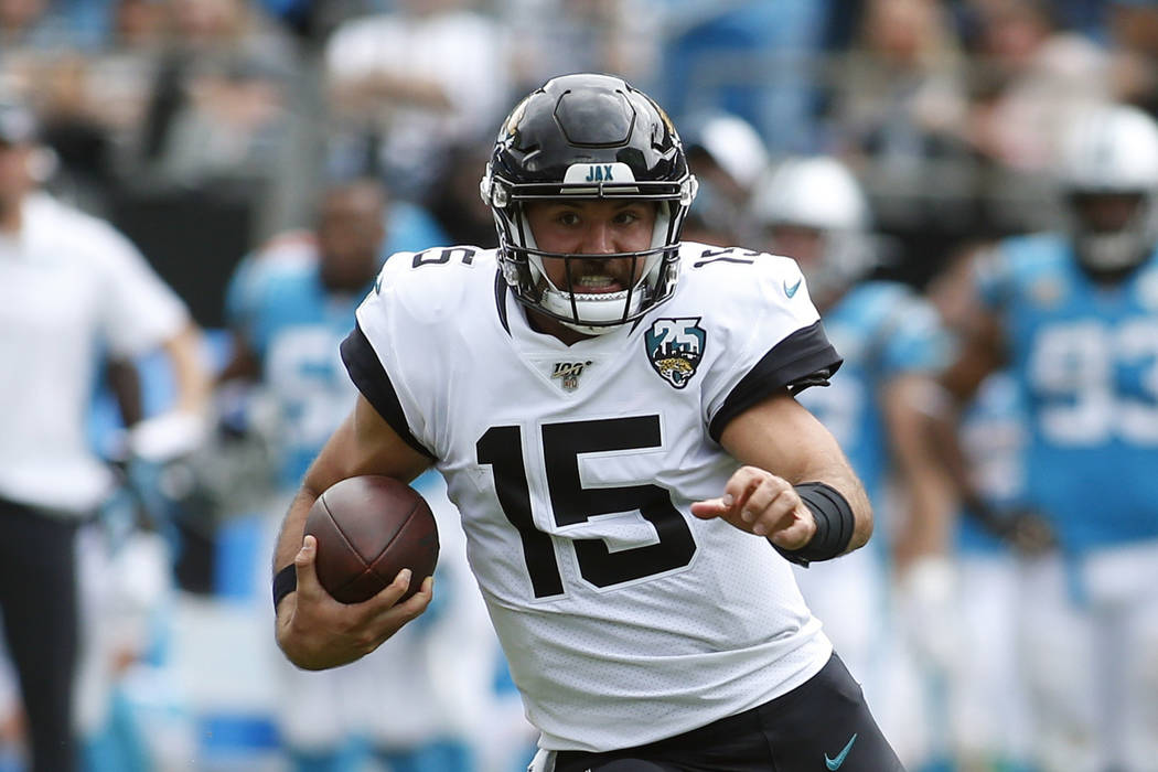 Jacksonville Jaguars quarterback Gardner Minshew (15) runs against the Carolina Panthers during ...