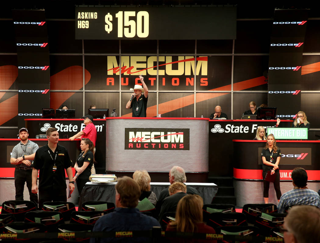 Auctioneer Matt Moravec of David City, Neb. calls during Mecum Las Vegas auction at the Las Veg ...