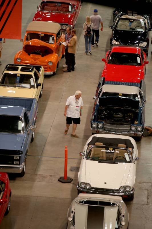 People check out cars during Mecum Las Vegas auction at the Las Vegas Convention Center Thursda ...