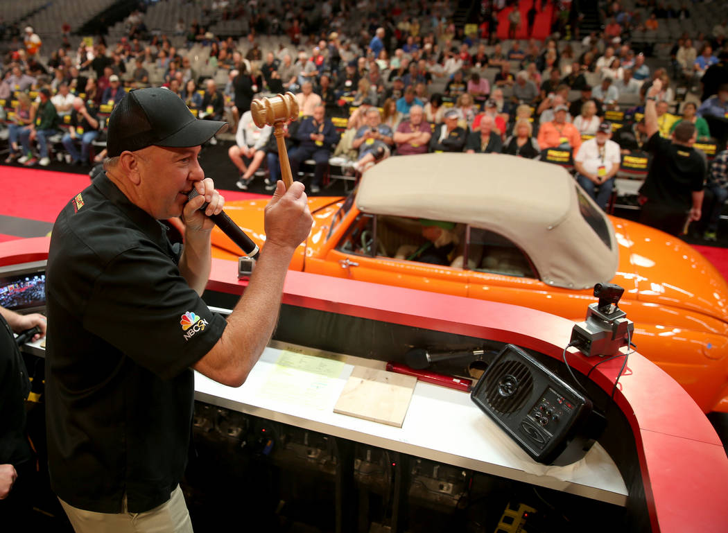 Auctioneer Russ Conklin of Hallsville, Mo. calls during Mecum Las Vegas auction at the Las Vega ...