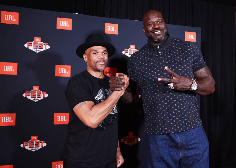 Darryl McDaniels of Run-D.M.C., left, mingles with Shaquille O'Neal during a meet and greet at ...