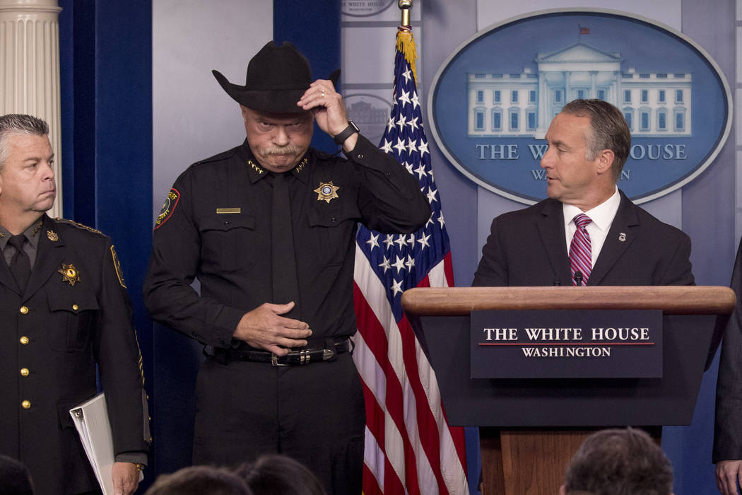 Immigration and Customs Enforcement Director Matt Albence, right, accompanied by sheriffs from ...