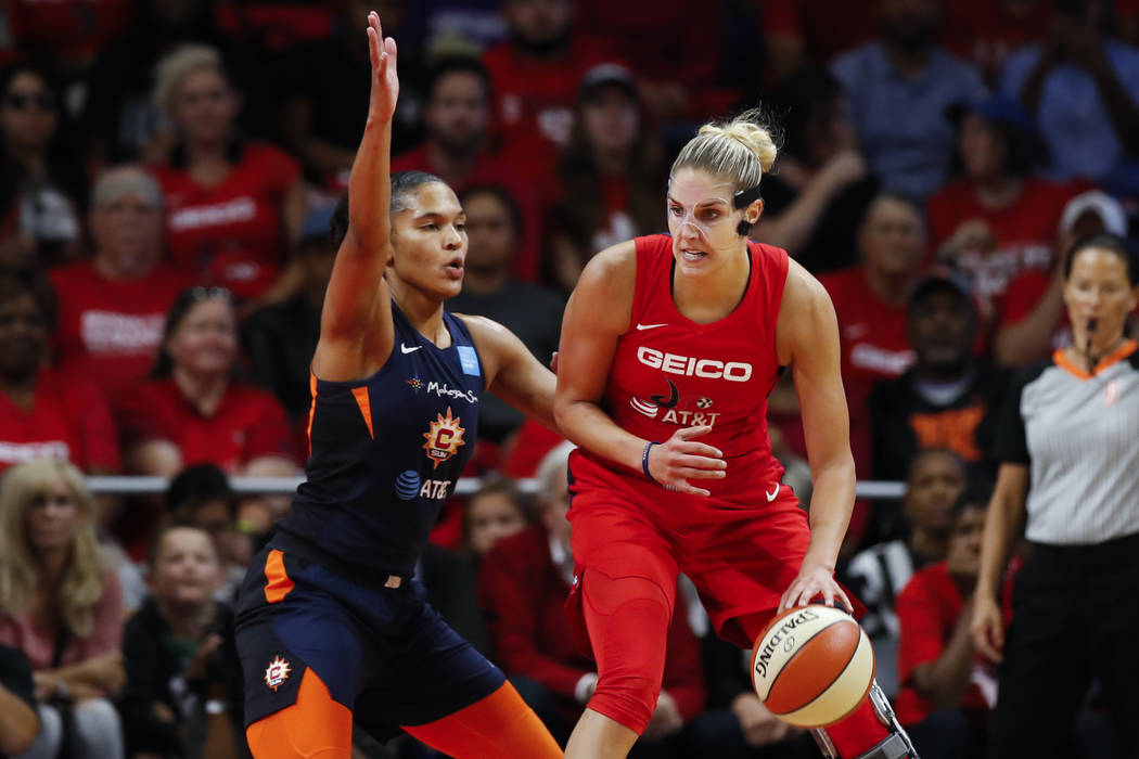 Washington Mystics forward Elena Delle Donne, right, drives against Connecticut Sun forward Aly ...