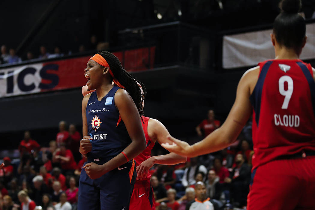 Connecticut Sun forward Jonquel Jones, left, celebrates after her basket during the first half ...