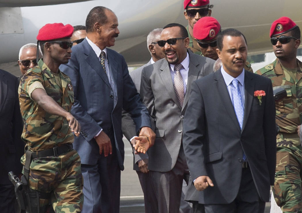 FILE - In this Saturday, July 14, 2018 file photo, Eritrean President Isaias Afwerki, center le ...