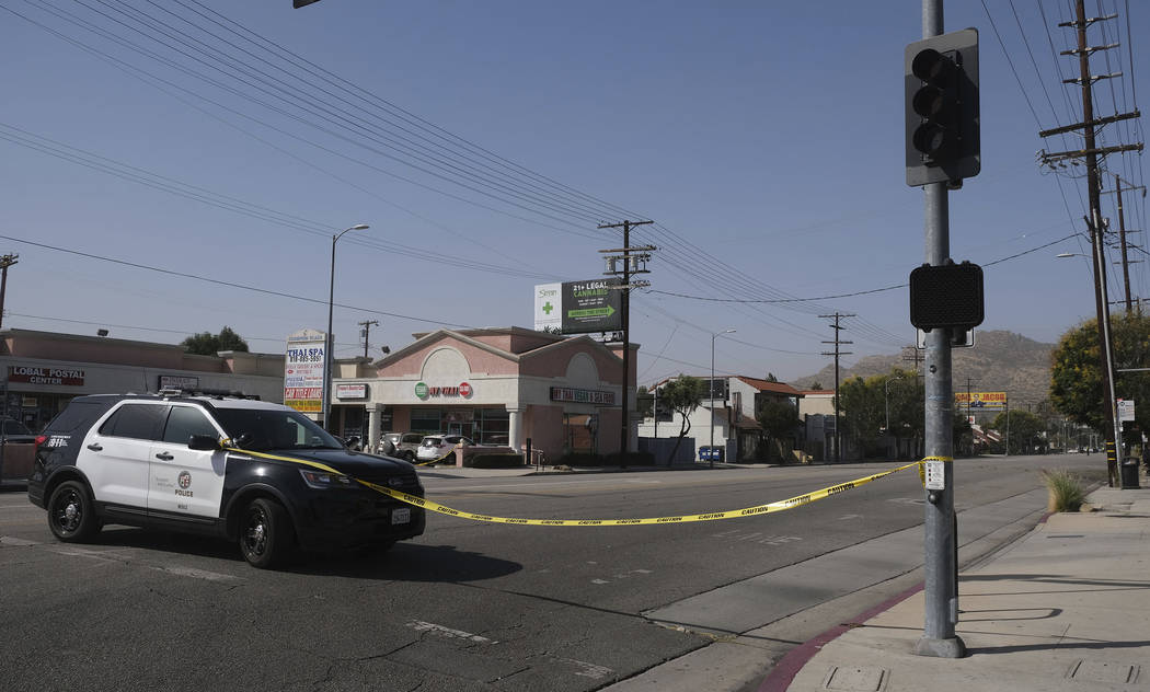 Strong Santa Ana winds in Chatsworth, Calif., blew across power lines causing them to arc and t ...