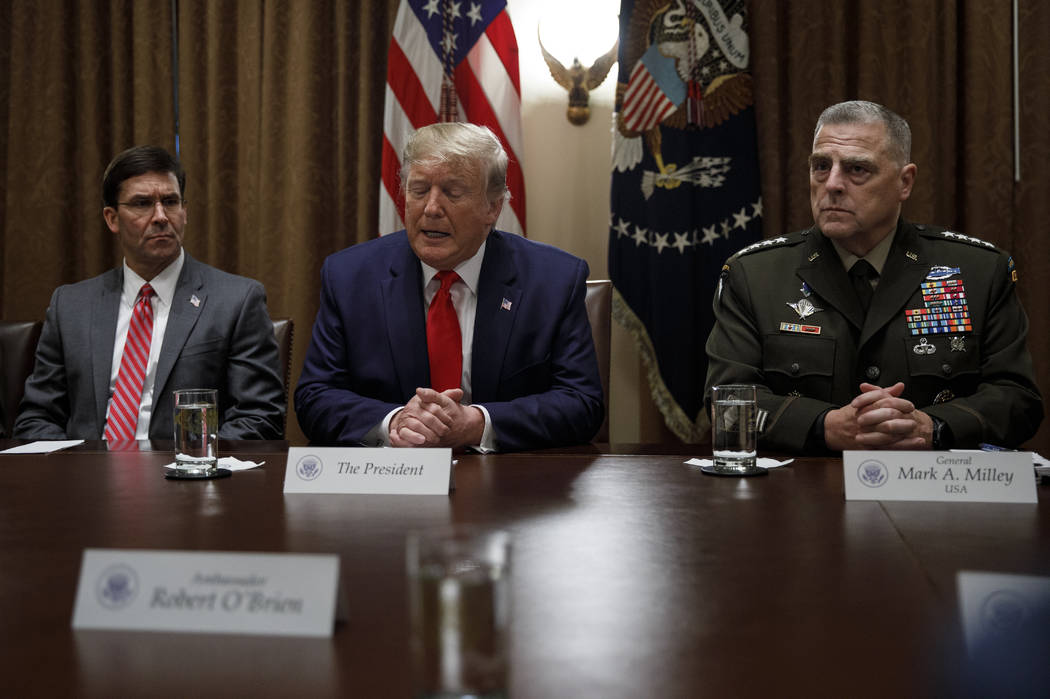 President Donald Trump, joined by from left, Defense Secretary Mark Esper, and Chairman of the ...