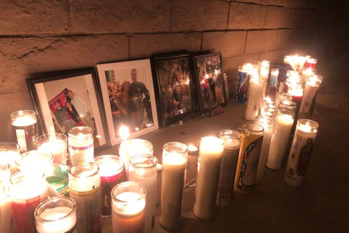 Pictures of 24-year-old Marco Antonio Alvizo are surrounded by religious candles on Friday, Oct ...