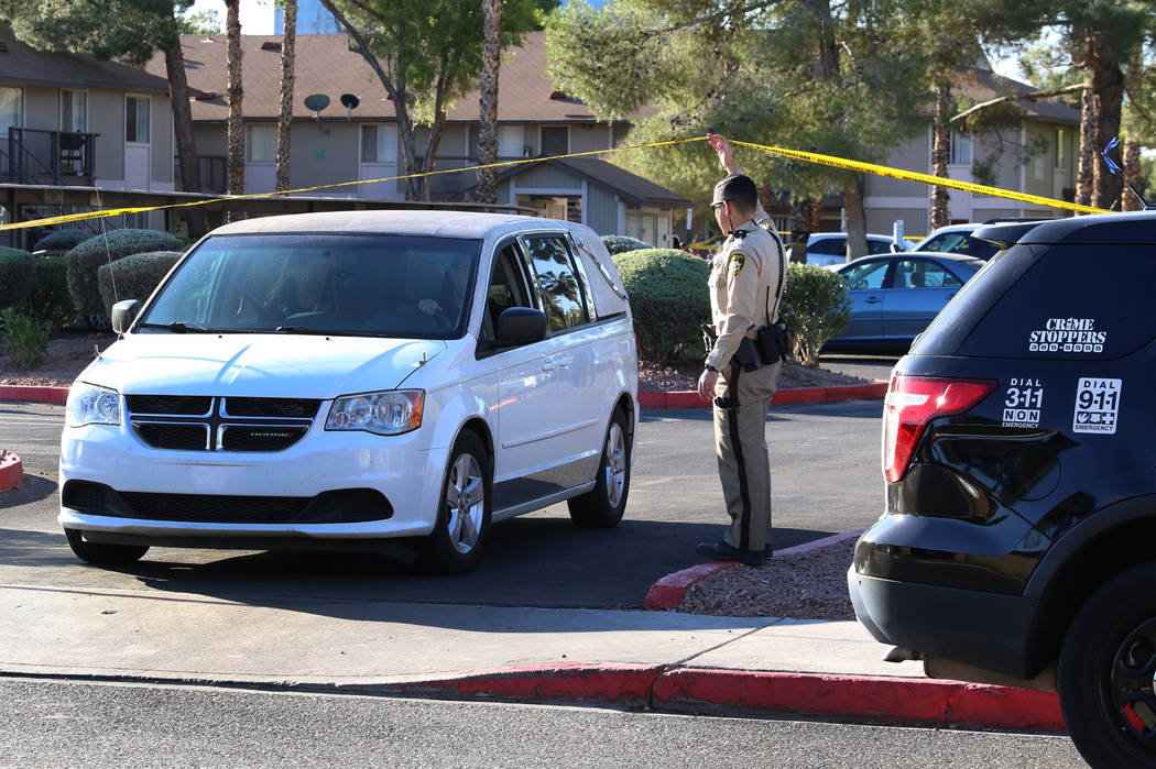 A van carrying the body of a shooting victim leaves the crime scene as Las Vegas police investi ...