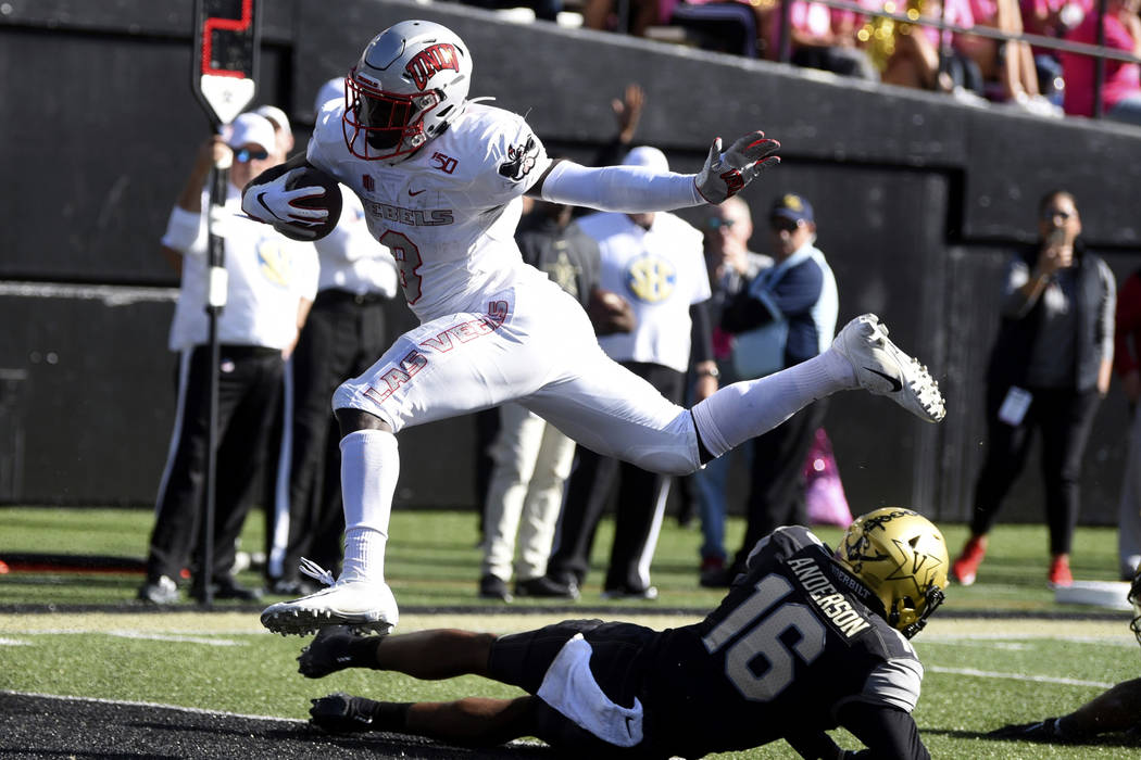 UNLV running back Charles Williams (8) scores a touchdown past Vanderbilt cornerback BJ Anderso ...