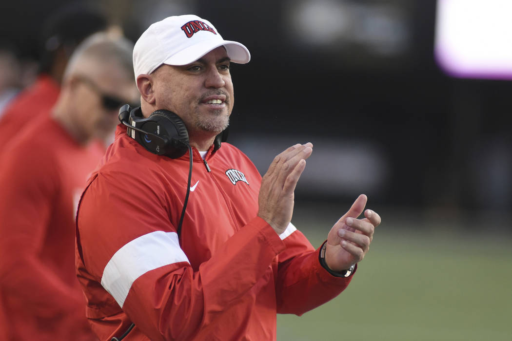 UNLV Head Coach Tony Sanchez encourages his team against Vanderbilt in the second half of an NC ...