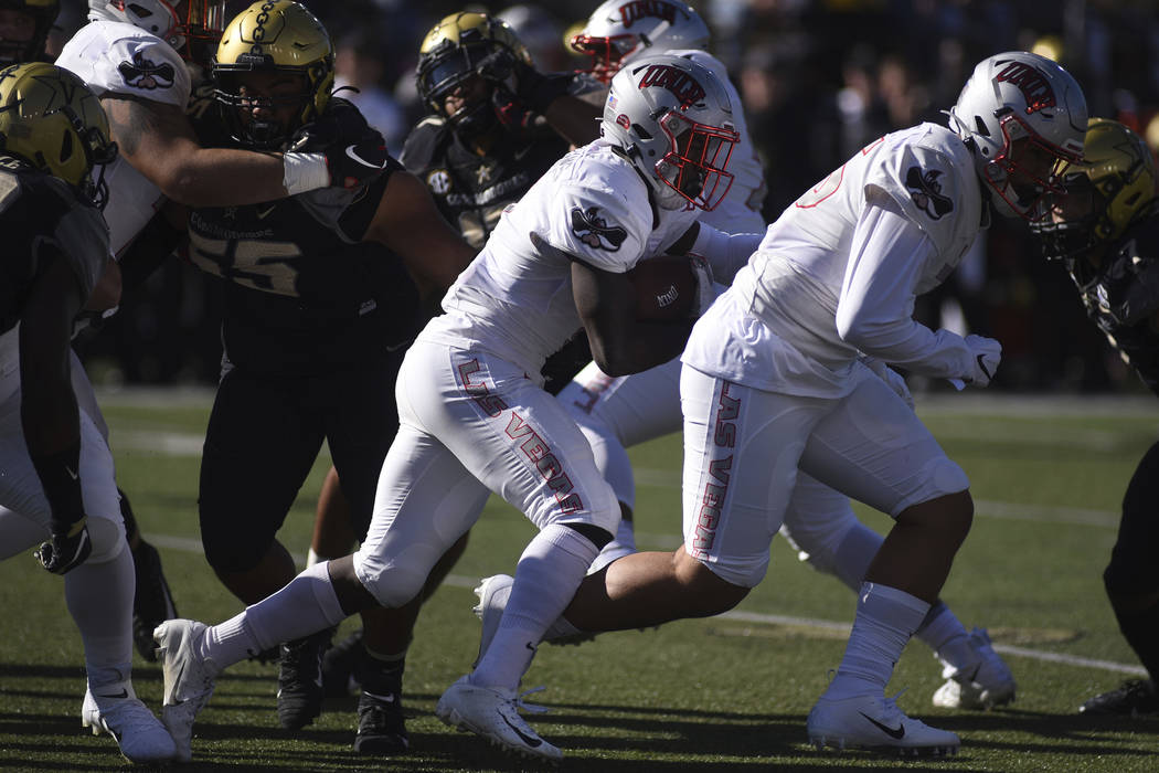 UNLV running back Charles Williams (8) runs against Vanderbilt in the first half of an NCAA col ...