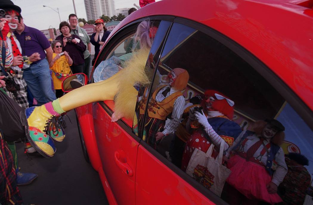 A Ringling Bros. and Barnum & Bailey Circus alumni clown climbs into a 2001 Volkswagen Beet ...