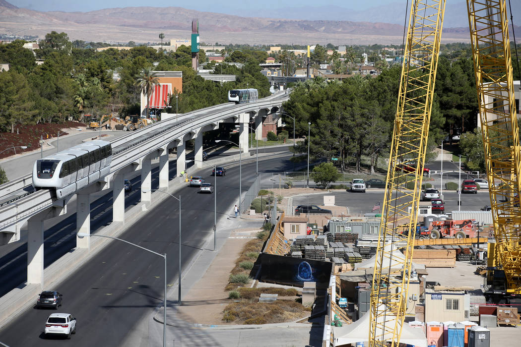 Las Vegas Monorail trains pass the under-construction MSG Sphere performance venue in Las Vegas ...