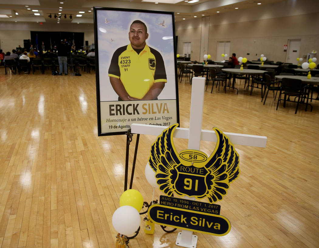 A cross for Erick Silva, a security guard who was shot trying to help people escape the Oct. 1, ...